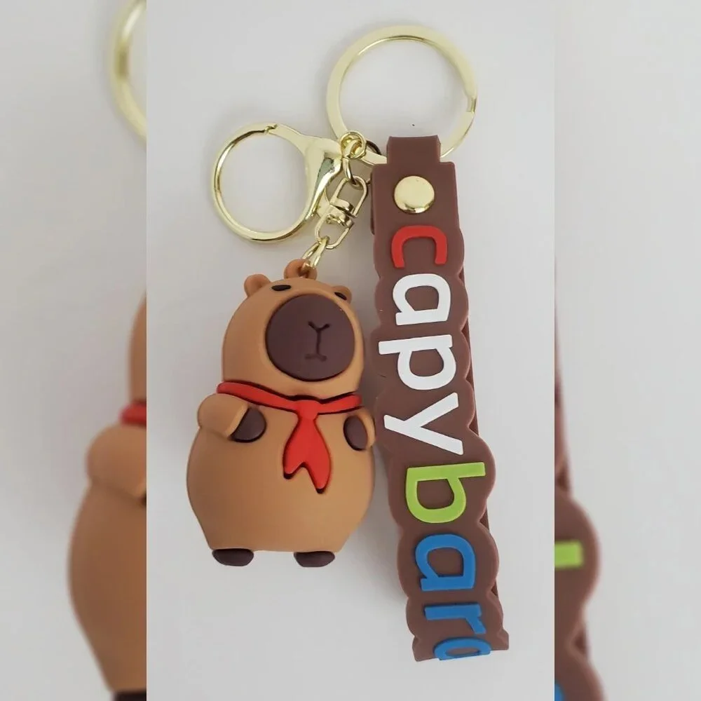 NWT CAPYBARA KEY CHAIN DIFFERENT ACTIONS 3D LOGO